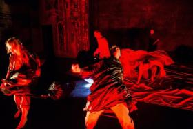 2014 TCHF Production of FRANKENSTEIN featuring undulating bodies drowning in harsh red light. Photo by Dan Norman