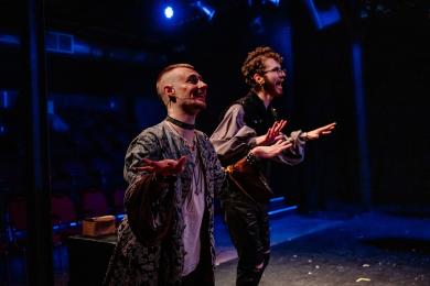 Actors doubled up on stage in the production Something Rotten