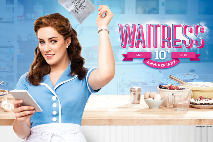 A woman in front of a kitchen counter with bakery tools and items on it, with the title of the show bolded with hot pink next to her. 