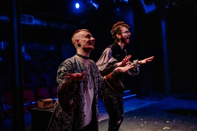 Actors doubled up on stage in the production Something Rotten